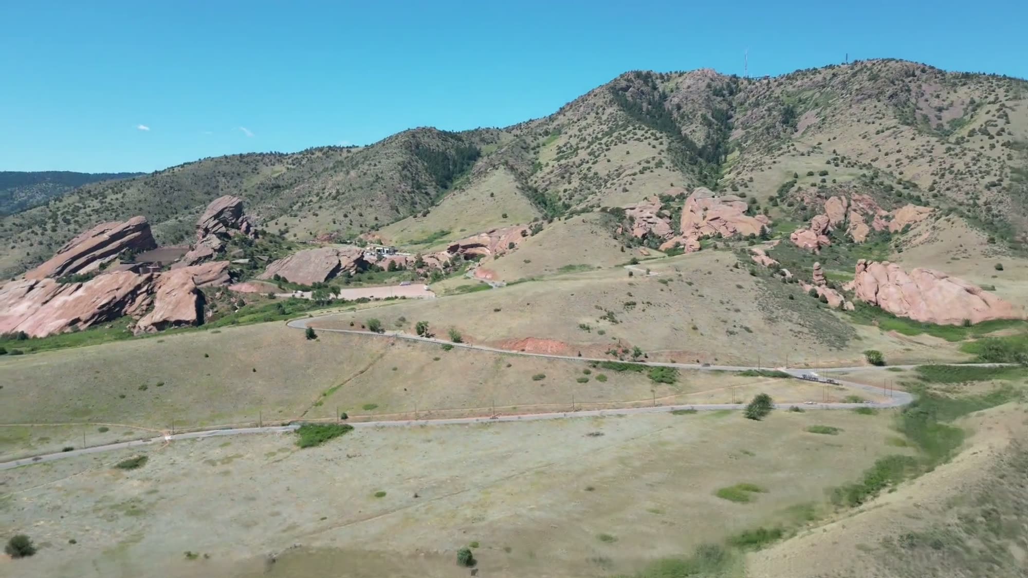 Aerial view over the red sandstone formations at Red Rocks near Morrison, Colorado, with the foothills behind